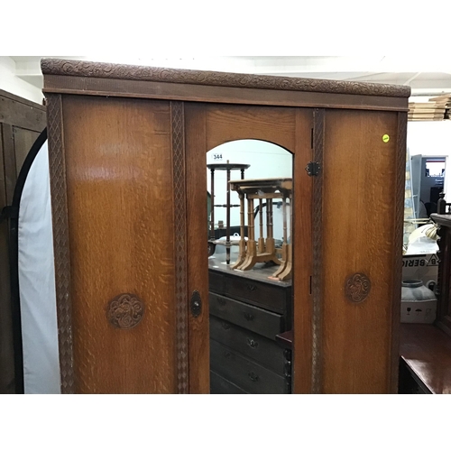 344 - VINTAGE OAK WARDROBE WITH MIRROR DOOR AND CARVED DECORATION A/F H74