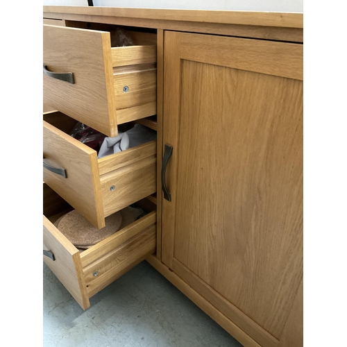 426 - MODERN LIGHT OAK SIDEBOARD FITTED WITH 2 CUPBOARDS AND 3 DRAWERS H34