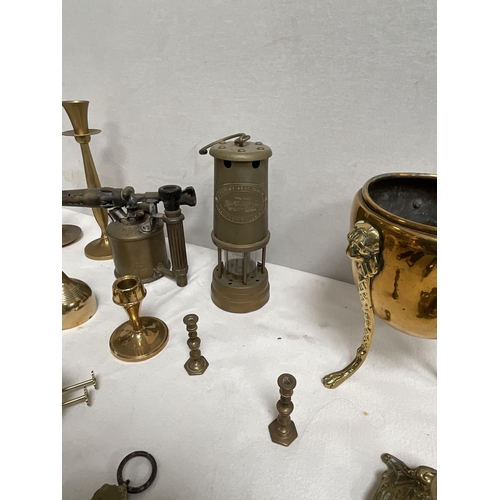 52 - BOX OF BRASSWARE TO INCLUDE CANDELSTICKS BLOW LAMPS JARDINERE ETC