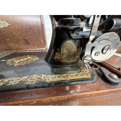 61 - CASED SINGER SEWING MACHINE