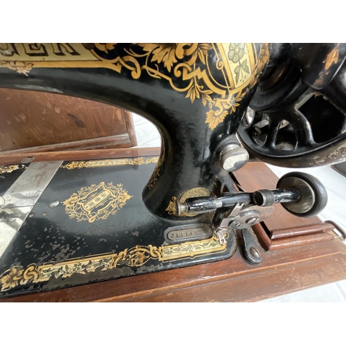 61 - CASED SINGER SEWING MACHINE