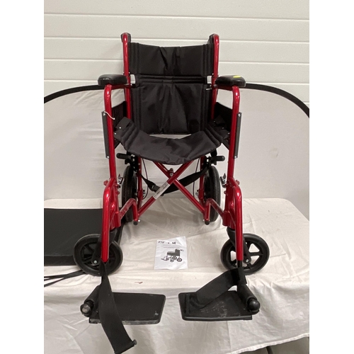 216 - LIGHTWEIGHT SELF PROPELLED FOLDING WHEELCHAIR C/W SEAT PAD AND FOOTREST