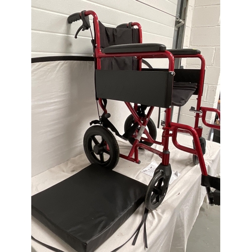 216 - LIGHTWEIGHT SELF PROPELLED FOLDING WHEELCHAIR C/W SEAT PAD AND FOOTREST