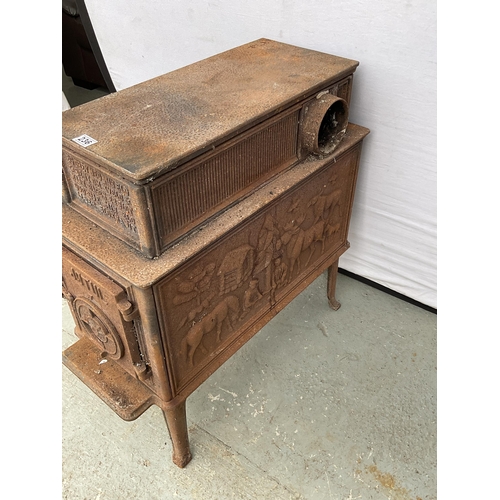 236 - CAST IRON DECORATIVE STOVE DECORATED WITH ANIMALS AND PEOPLE H31