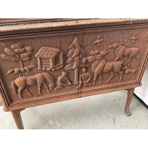 236 - CAST IRON DECORATIVE STOVE DECORATED WITH ANIMALS AND PEOPLE H31