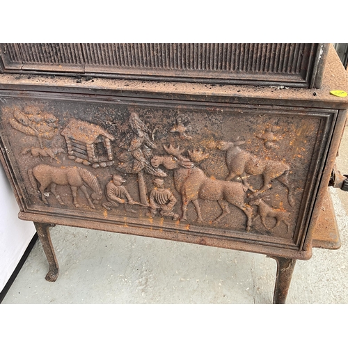 236 - CAST IRON DECORATIVE STOVE DECORATED WITH ANIMALS AND PEOPLE H31