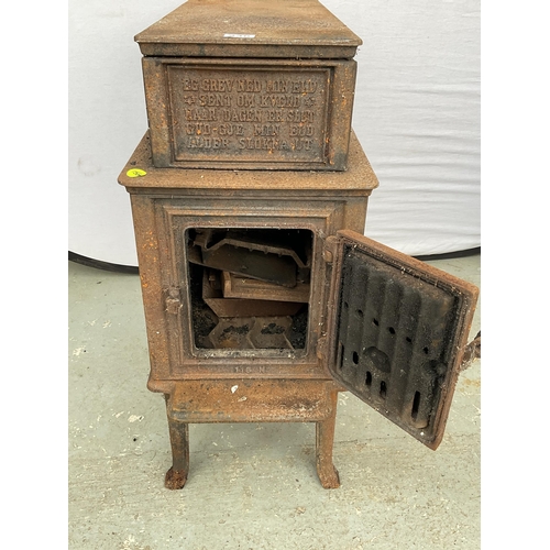 236 - CAST IRON DECORATIVE STOVE DECORATED WITH ANIMALS AND PEOPLE H31