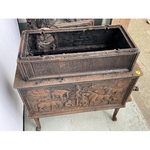 236 - CAST IRON DECORATIVE STOVE DECORATED WITH ANIMALS AND PEOPLE H31