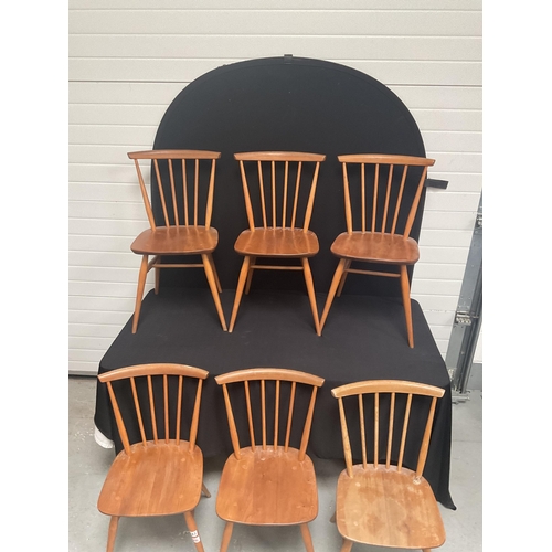 243 - 6 BLONDE ERCOL STRETCHERED DINING CHAIRS WITH SPINDLE BACK (1 NEEDS REPAIR)