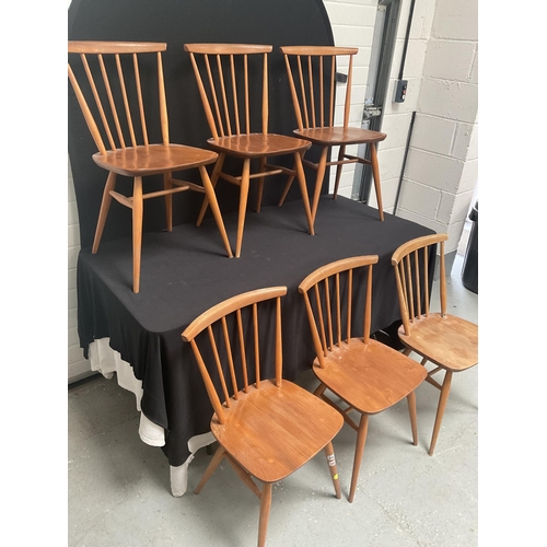 243 - 6 BLONDE ERCOL STRETCHERED DINING CHAIRS WITH SPINDLE BACK (1 NEEDS REPAIR)