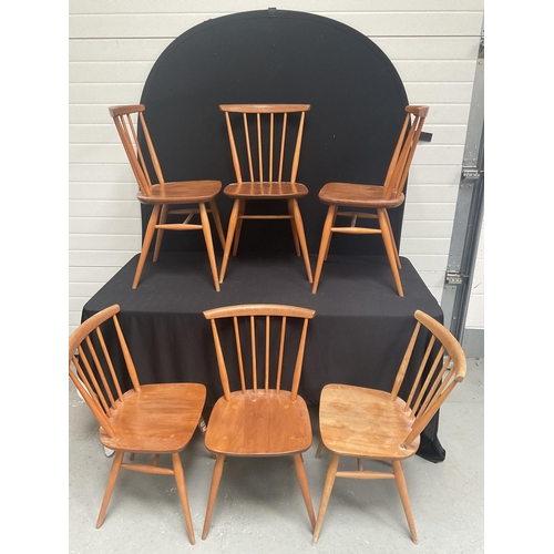 243 - 6 BLONDE ERCOL STRETCHERED DINING CHAIRS WITH SPINDLE BACK (1 NEEDS REPAIR)