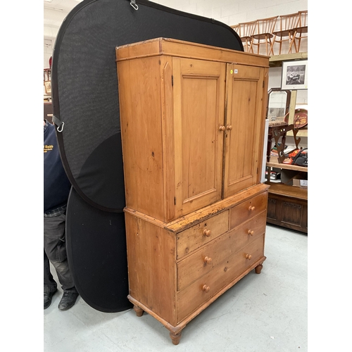 299 - VICTORIAN PINE PRESS WITH TWO DOORS TO TOP WITH FITTED SHELVES TO INTERIOR WITH 2 SHORT DRAWERS OVER... 