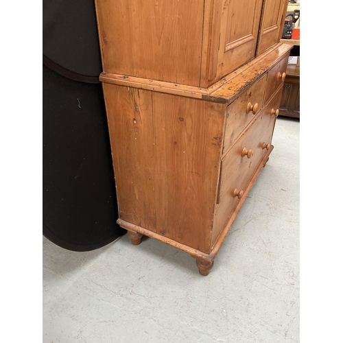 299 - VICTORIAN PINE PRESS WITH TWO DOORS TO TOP WITH FITTED SHELVES TO INTERIOR WITH 2 SHORT DRAWERS OVER... 