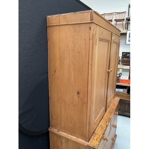 299 - VICTORIAN PINE PRESS WITH TWO DOORS TO TOP WITH FITTED SHELVES TO INTERIOR WITH 2 SHORT DRAWERS OVER... 