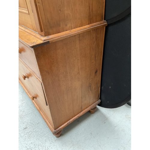 299 - VICTORIAN PINE PRESS WITH TWO DOORS TO TOP WITH FITTED SHELVES TO INTERIOR WITH 2 SHORT DRAWERS OVER... 