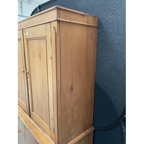 299 - VICTORIAN PINE PRESS WITH TWO DOORS TO TOP WITH FITTED SHELVES TO INTERIOR WITH 2 SHORT DRAWERS OVER... 