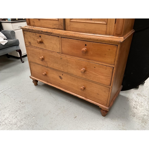 299 - VICTORIAN PINE PRESS WITH TWO DOORS TO TOP WITH FITTED SHELVES TO INTERIOR WITH 2 SHORT DRAWERS OVER... 