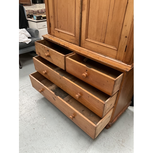 299 - VICTORIAN PINE PRESS WITH TWO DOORS TO TOP WITH FITTED SHELVES TO INTERIOR WITH 2 SHORT DRAWERS OVER... 