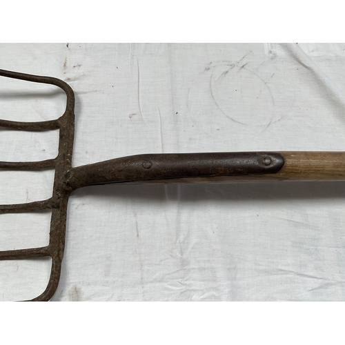 39 - 2 VINTAGE HAY FORKS AND A VINTAGE PICK AXE