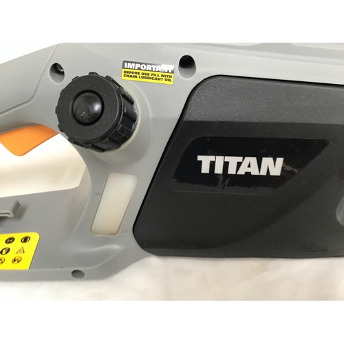 57 - TITAN 2000W ELECTRIC CHAINSAW IN BOX (NEEDS ASSEMBLY)