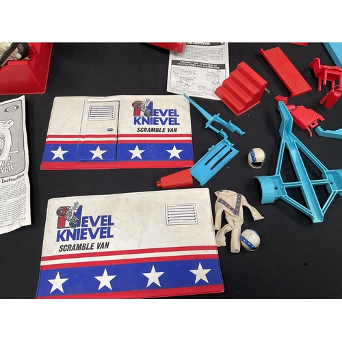 201 - EVIL KNIEVEL SCRAMBLE VAN AND CONTENTS WITH INSTRUCTIONS EVIL KNIEVEL STUNT CYCLE AND INSTRUCTIONS A... 