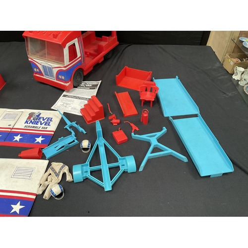 201 - EVIL KNIEVEL SCRAMBLE VAN AND CONTENTS WITH INSTRUCTIONS EVIL KNIEVEL STUNT CYCLE AND INSTRUCTIONS A... 