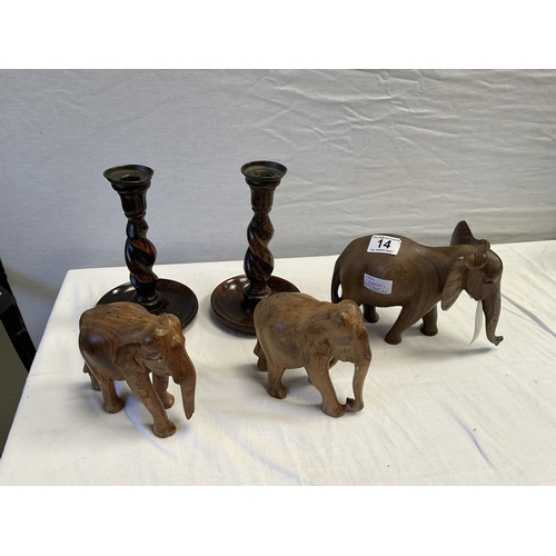 14 - 3 CARVED ELEPHANTS AND A PAIR OF BARLEY TWIST CANDLESTICKS