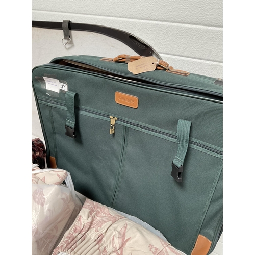 27 - LARGE SUITCASE OF CURTAINS