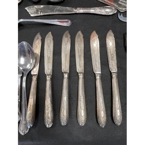 69 - BOX OF CUTLERY, OIL LAMP ETC