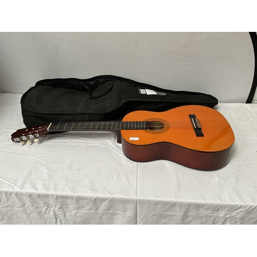 137 - CASED ACOUSTIC GUITAR