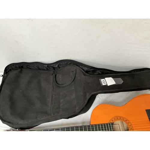 137 - CASED ACOUSTIC GUITAR