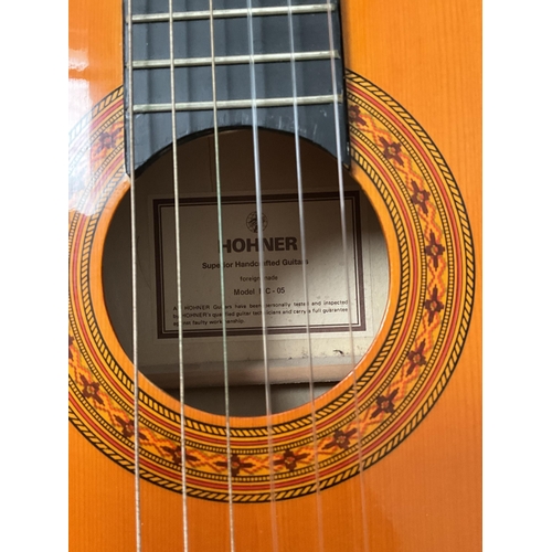 137 - CASED ACOUSTIC GUITAR