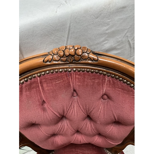 219 - REPRODUCTION BEDROOM ARMCHAIR WITH CARVED FRAME BUTTON BACK AND UPHOLSTERED SEAT