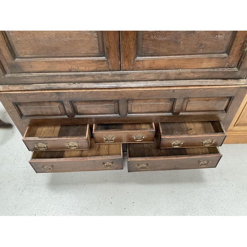 269 - EARLY OAK PRESS CUPBOARD WITH 2 DOORS TO TOP OVER 4 FIELDED PANELS AND 5 DRAWERS TO BASE ON BRACKET ... 