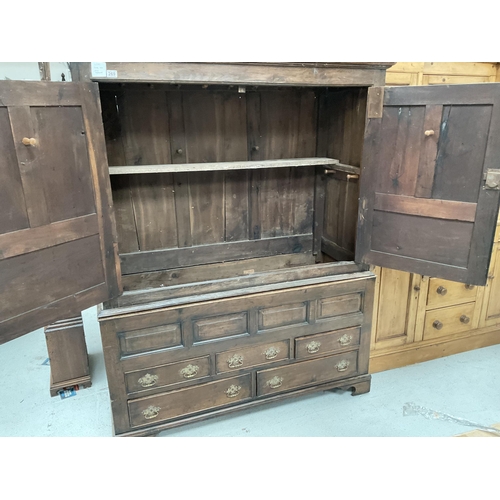 269 - EARLY OAK PRESS CUPBOARD WITH 2 DOORS TO TOP OVER 4 FIELDED PANELS AND 5 DRAWERS TO BASE ON BRACKET ... 