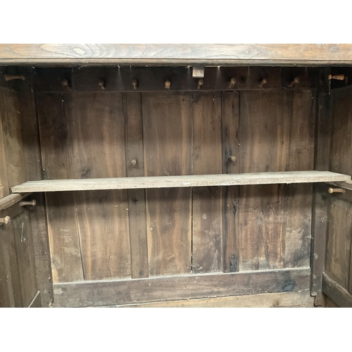 269 - EARLY OAK PRESS CUPBOARD WITH 2 DOORS TO TOP OVER 4 FIELDED PANELS AND 5 DRAWERS TO BASE ON BRACKET ... 