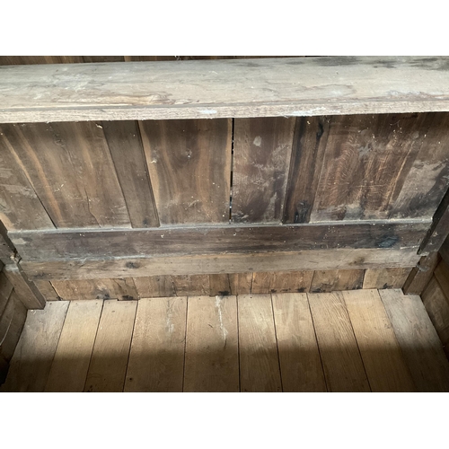 269 - EARLY OAK PRESS CUPBOARD WITH 2 DOORS TO TOP OVER 4 FIELDED PANELS AND 5 DRAWERS TO BASE ON BRACKET ... 