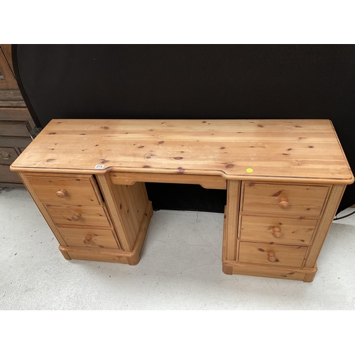 275 - TWIN PEDESTAL WAXED PINE KNEEHOLE DESK WITH 9 DRAWERS H30