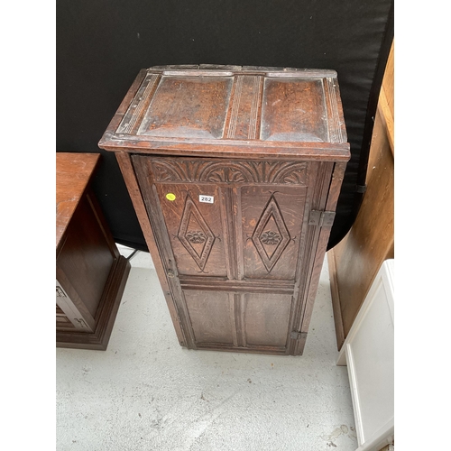 282 - EARLY OAK CARVED CABINET WITH SINGLE DOOR AND 4 PANELS TO FRONT H44