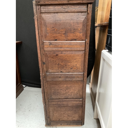 282 - EARLY OAK CARVED CABINET WITH SINGLE DOOR AND 4 PANELS TO FRONT H44