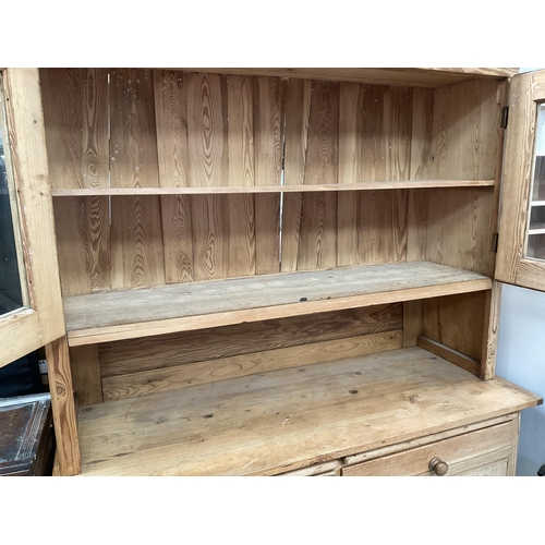 286 - VICTORIAN STRIPPED PINE KITCHEN PIECE WITH 2 GLAZED DOORS TO TOP CENTRAL OPEN AREA - THE BASE WITH 2... 