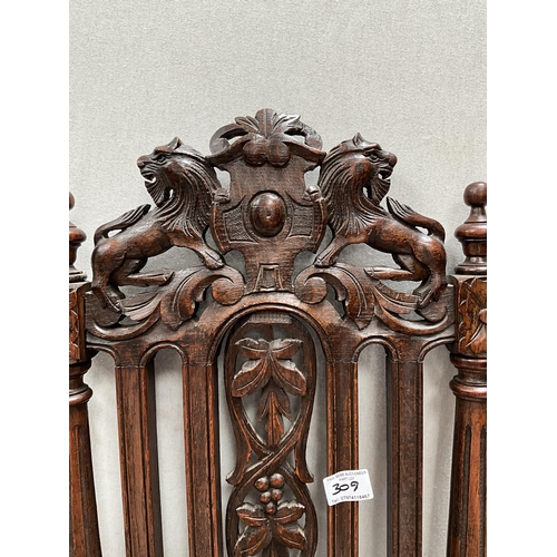 309 - PAIR OF HEAVILY CARVED OAK HALL CHAIRS WITH LION DECORATION TO TOP, CARVED SEATS AND STRETCHERED BAS... 