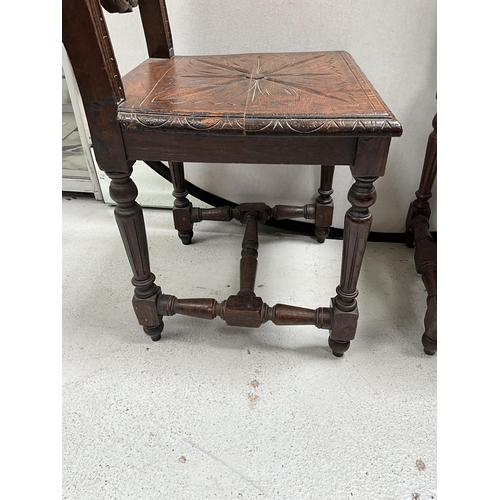 309 - PAIR OF HEAVILY CARVED OAK HALL CHAIRS WITH LION DECORATION TO TOP, CARVED SEATS AND STRETCHERED BAS... 