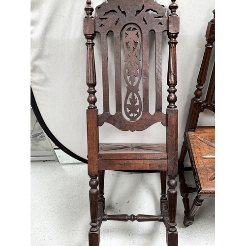 309 - PAIR OF HEAVILY CARVED OAK HALL CHAIRS WITH LION DECORATION TO TOP, CARVED SEATS AND STRETCHERED BAS... 