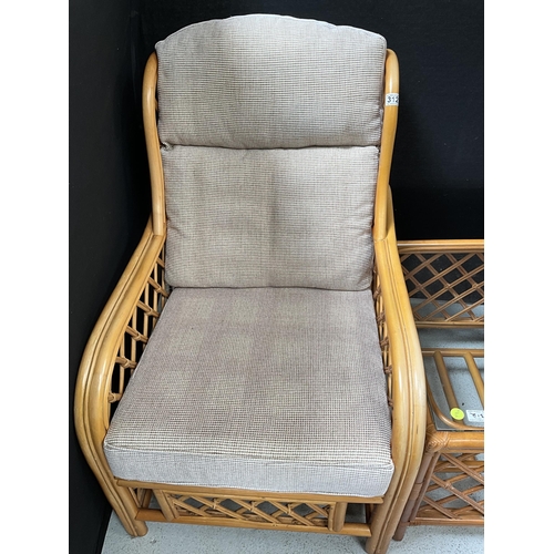 312 - PAIR OF CANE CONSERVATORY CHAIRS AND MATCHING GLASS TOPPED COFFEE TABLE