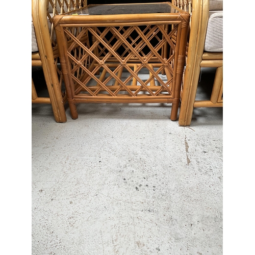 312 - PAIR OF CANE CONSERVATORY CHAIRS AND MATCHING GLASS TOPPED COFFEE TABLE