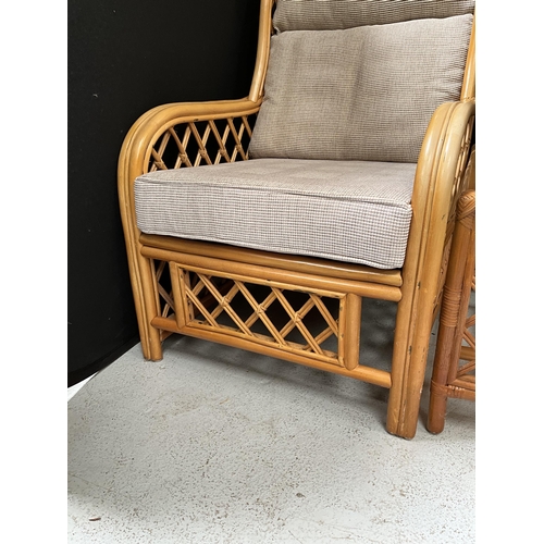 312 - PAIR OF CANE CONSERVATORY CHAIRS AND MATCHING GLASS TOPPED COFFEE TABLE