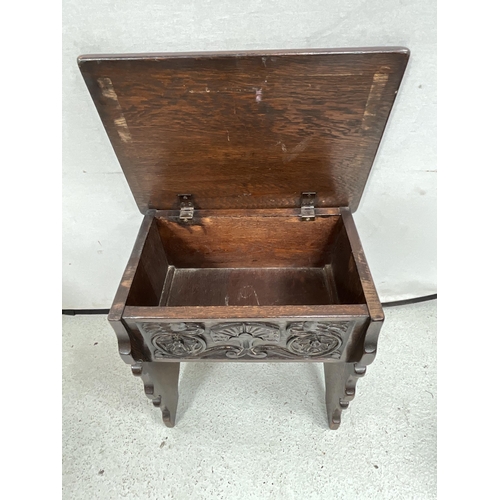 338 - VINTAGE OAK STORAGE STOOL WITH CARVED PANEL TO FRONT H21