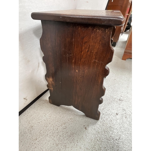 338 - VINTAGE OAK STORAGE STOOL WITH CARVED PANEL TO FRONT H21