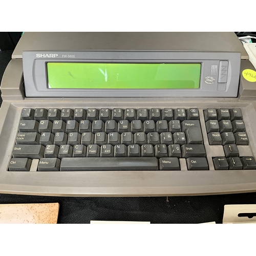 378 - SHARP ELECTRIC TYPEWRITER WITH INSTRUCTIONS AND CARTRIDGES AND A CLOCK RADIO